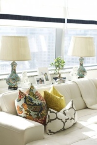 Use a console table between couch and wall/window to add decor and function.